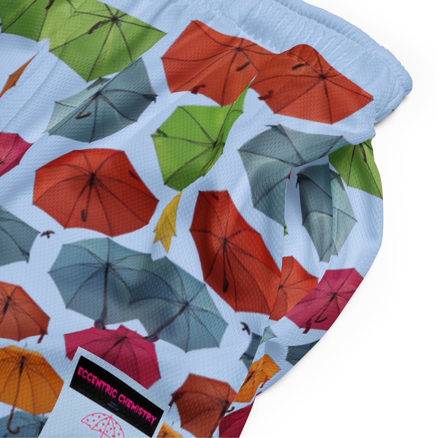 Unisex blue storm mesh shorts with all-over recycled print, designed by Eccentric Chemistry’s Laboratory of Strange & Stylish Things.