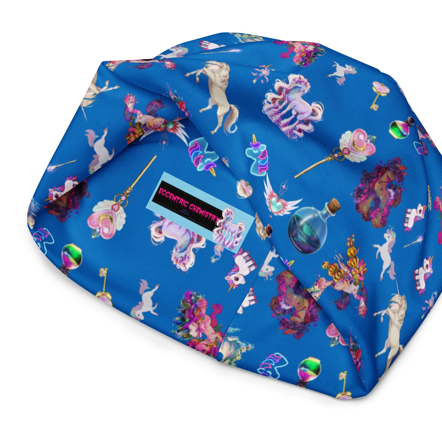 All-over print celestial unicorn beanie by Eccentric Chemistry, featuring a colorful cosmic and unicorn design on a white background.