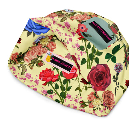 White floral print beanie from Eccentric Chemistry’s Laboratory of Strange & Stylish Things, featuring an all-over colorful design.
