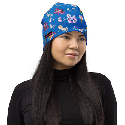 Eccentric Chemistry celestial unicorn print all-over knit beanie, white fabric with colorful cosmic and unicorn design.