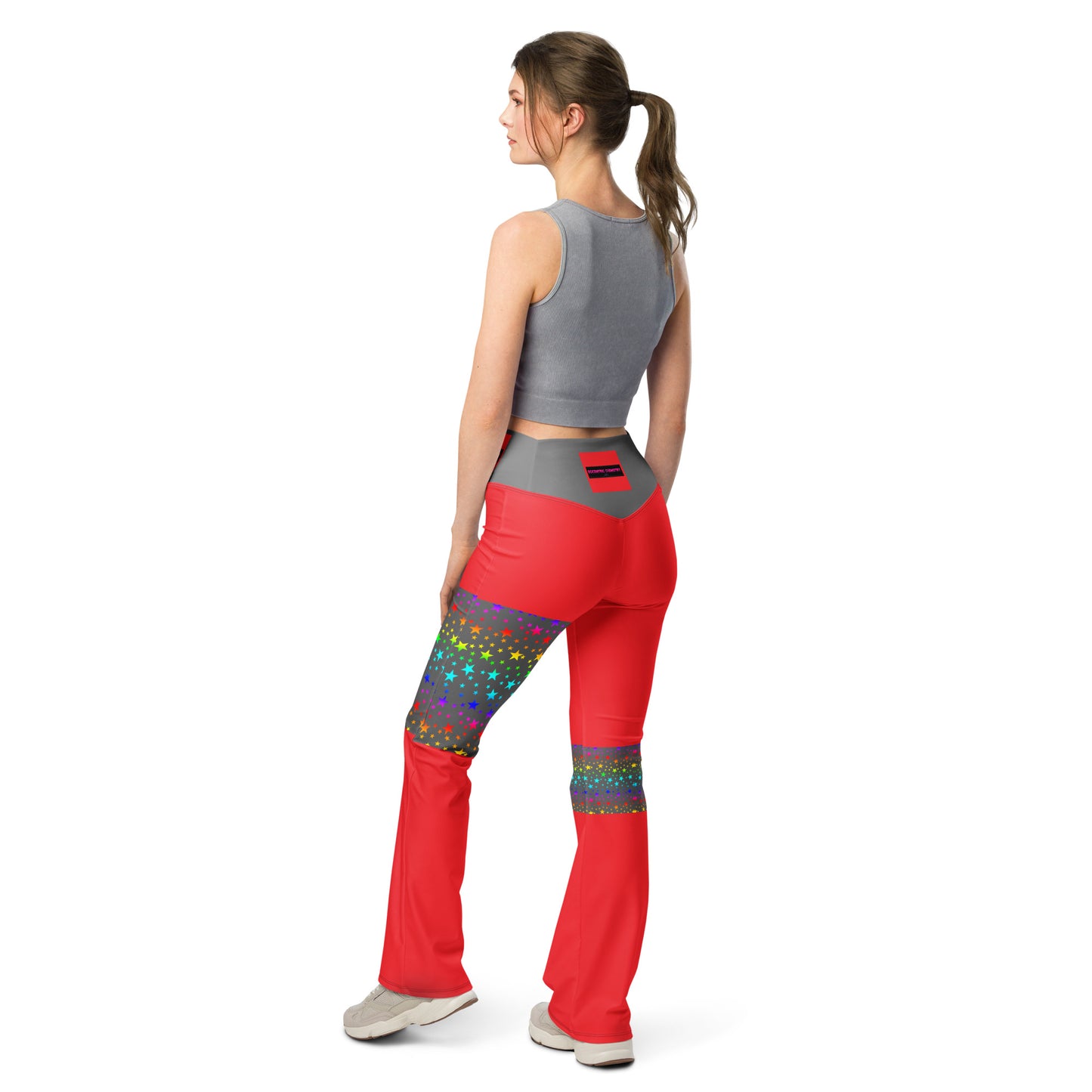 Women's flare leggings with cosmic color pop print from Eccentric Chemistry's Laboratory of Strange & Stylish Things, shown from the back.