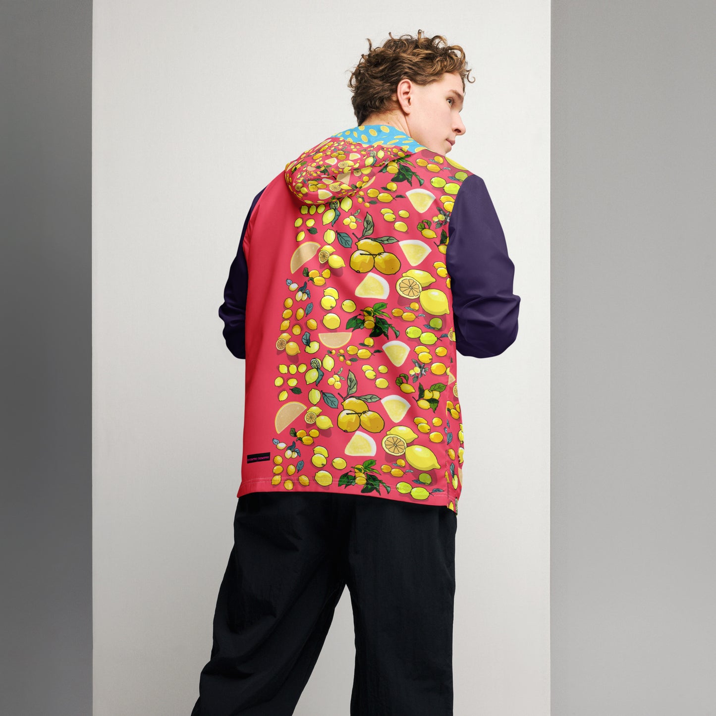 Men’s white windbreaker with all-over citrus storm print from Eccentric Chemistry’s Laboratory of Strange & Stylish Things.