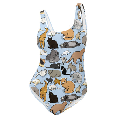 White one-piece swimsuit featuring an all-over feline-themed print, designed for feline soul synchronization by Eccentric Chemistry.