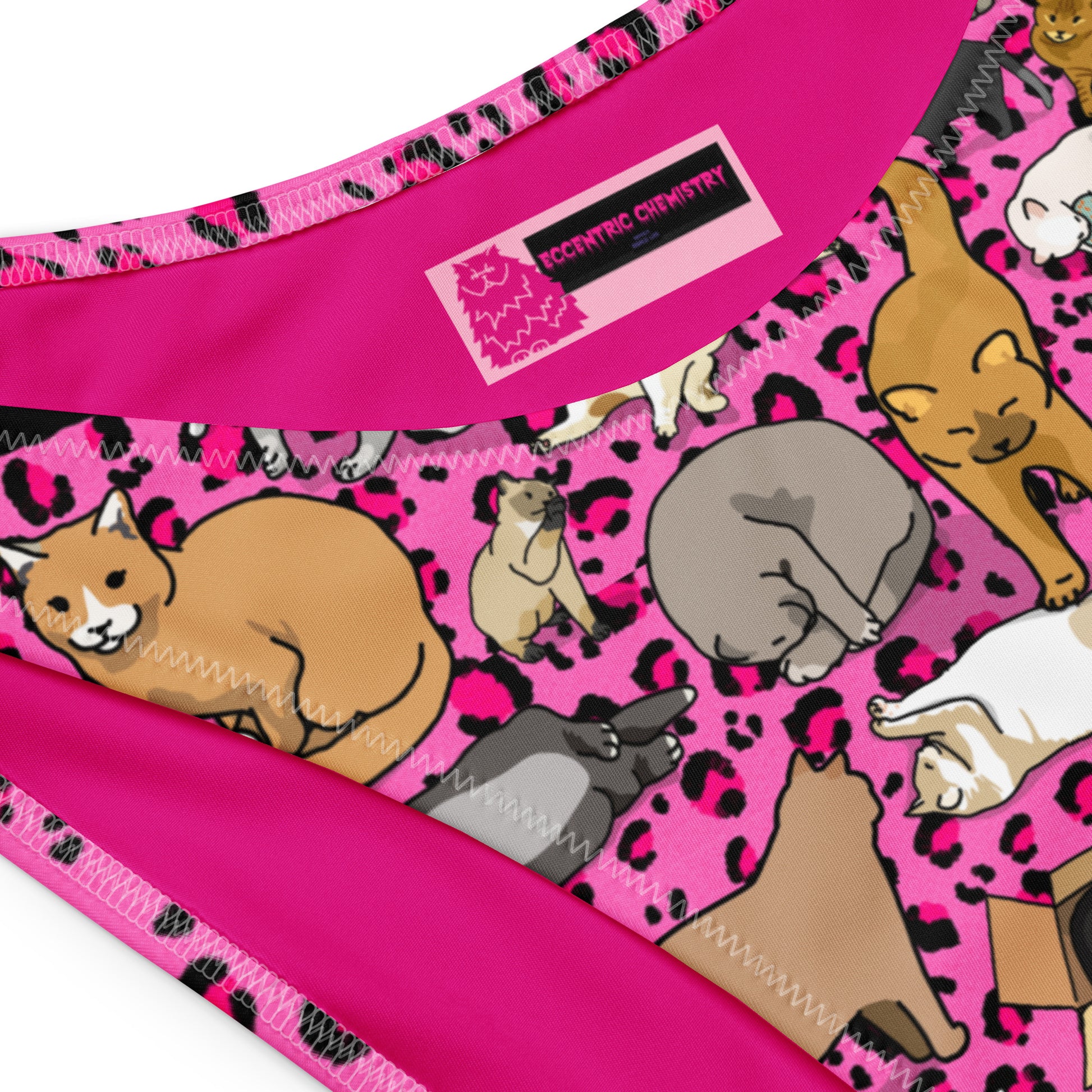 Pink recycled bandeau bikini with all-over white purr-wave print, featuring a stylish cut-sew design from Eccentric Chemistry.