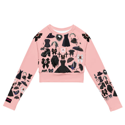 Women's pink gothic long sleeve crop top by Eccentric Chemistry, featuring all-over recycled print and trendy cut-sew design.