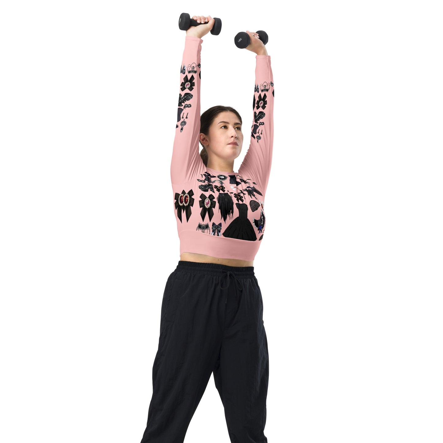 Pink gothic-style women's long sleeve crop top by Eccentric Chemistry with all-over recycled print, shown from the right front.