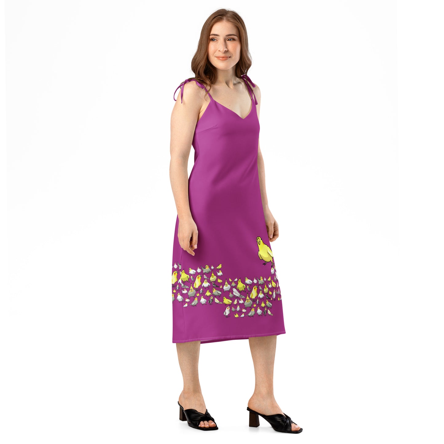 White tie-strap midi dress from Eccentric Chemistry with bright bird and crest all-over print, stylish slip design, right front view