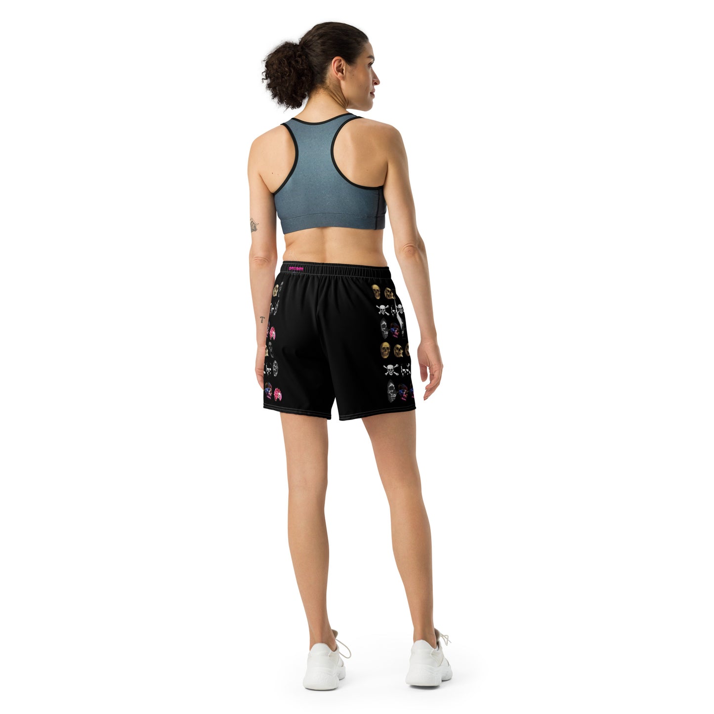 Unisex white athletic long shorts with all-over skull-themed print, featuring the Skull-Core Impact Reactor design by Eccentric Chemistry.