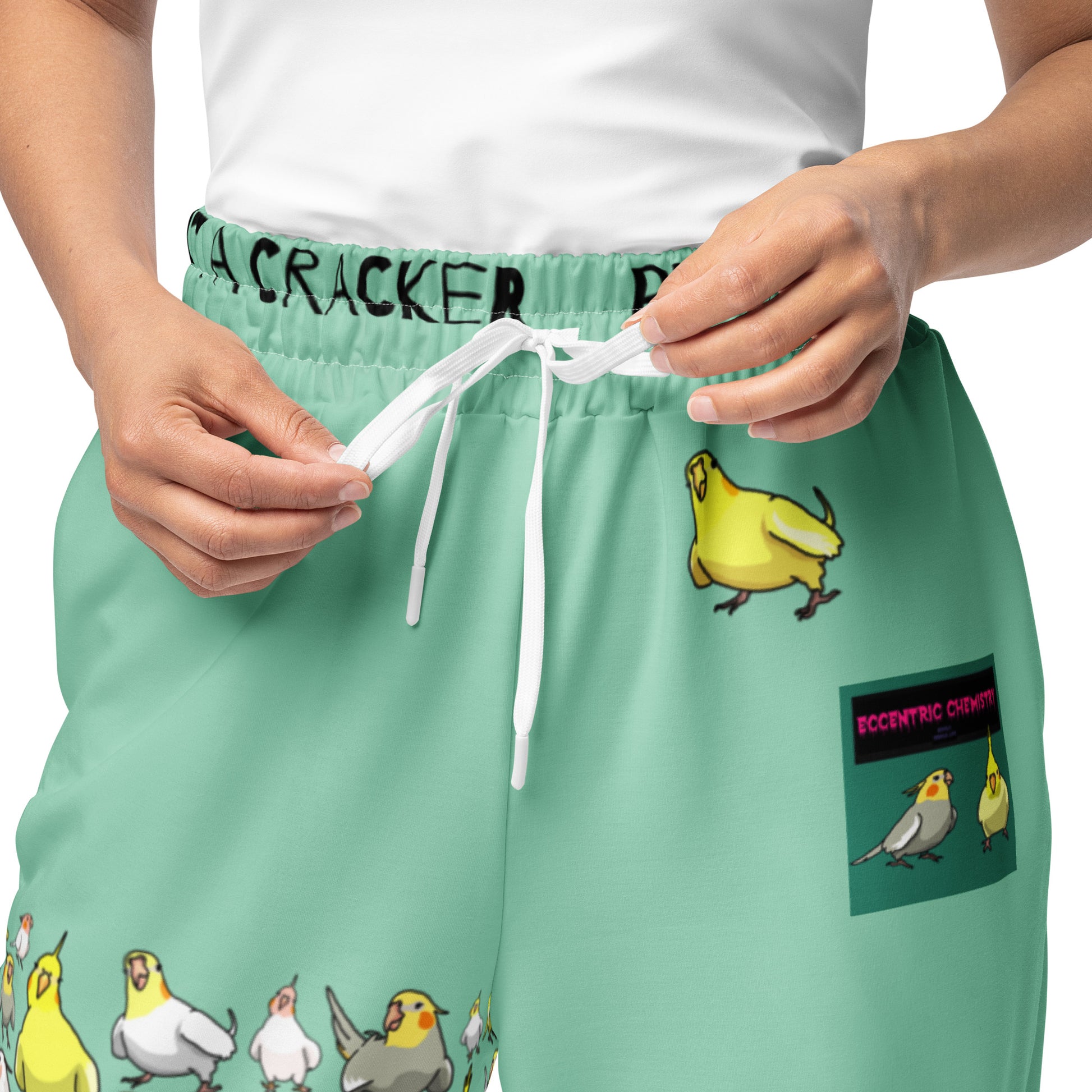 Unisex wide-leg joggers with a Cockatiel Garden Breeze print, made by Eccentric Chemistry's Laboratory of Strange & Stylish Things.