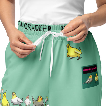 Unisex wide-leg joggers with a Cockatiel Garden Breeze print, made by Eccentric Chemistry's Laboratory of Strange & Stylish Things.