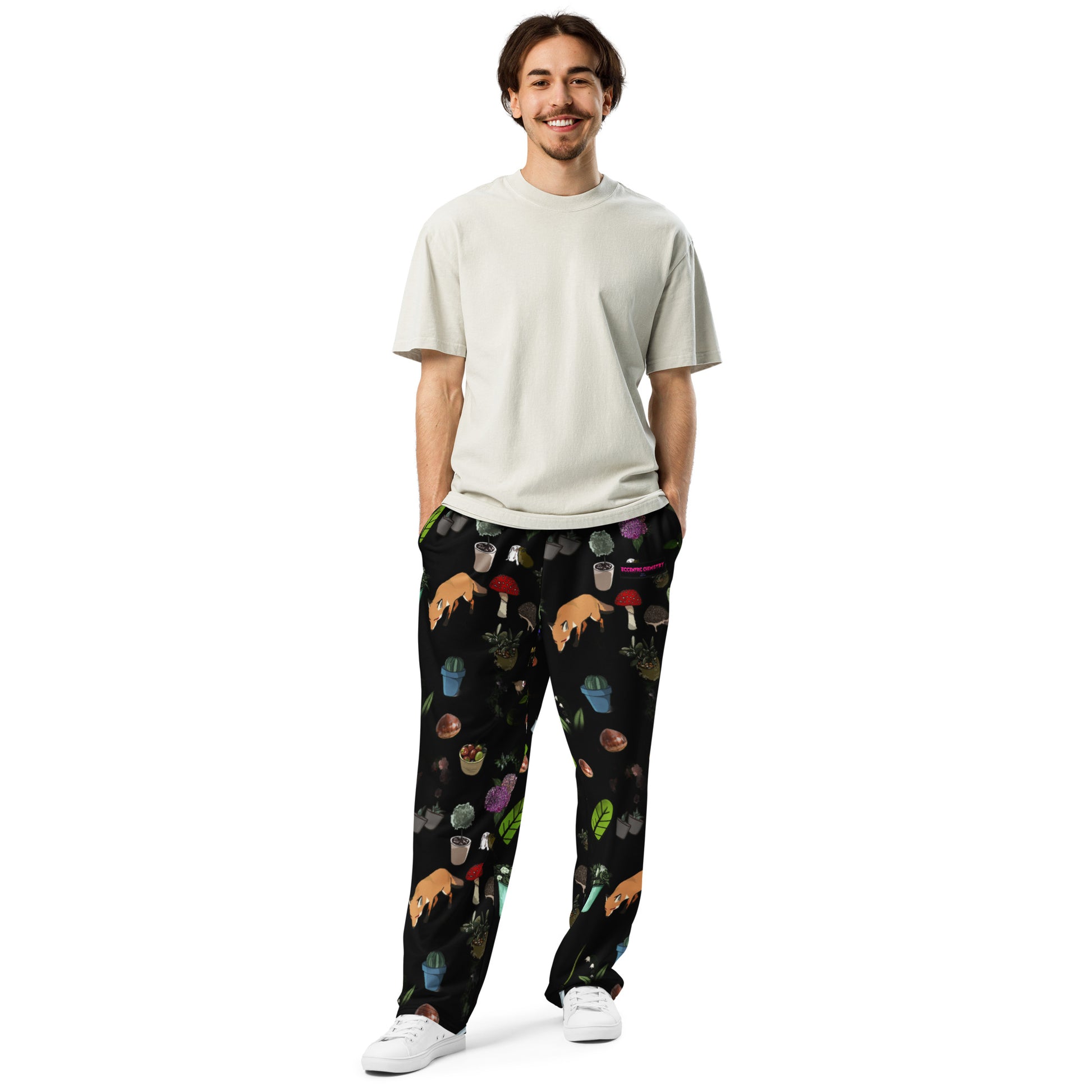 Unisex white wide-leg joggers with Earth-Kind Habitat print from Eccentric Chemistry's Tiny Shop of T-Shirt Horrors, front view.