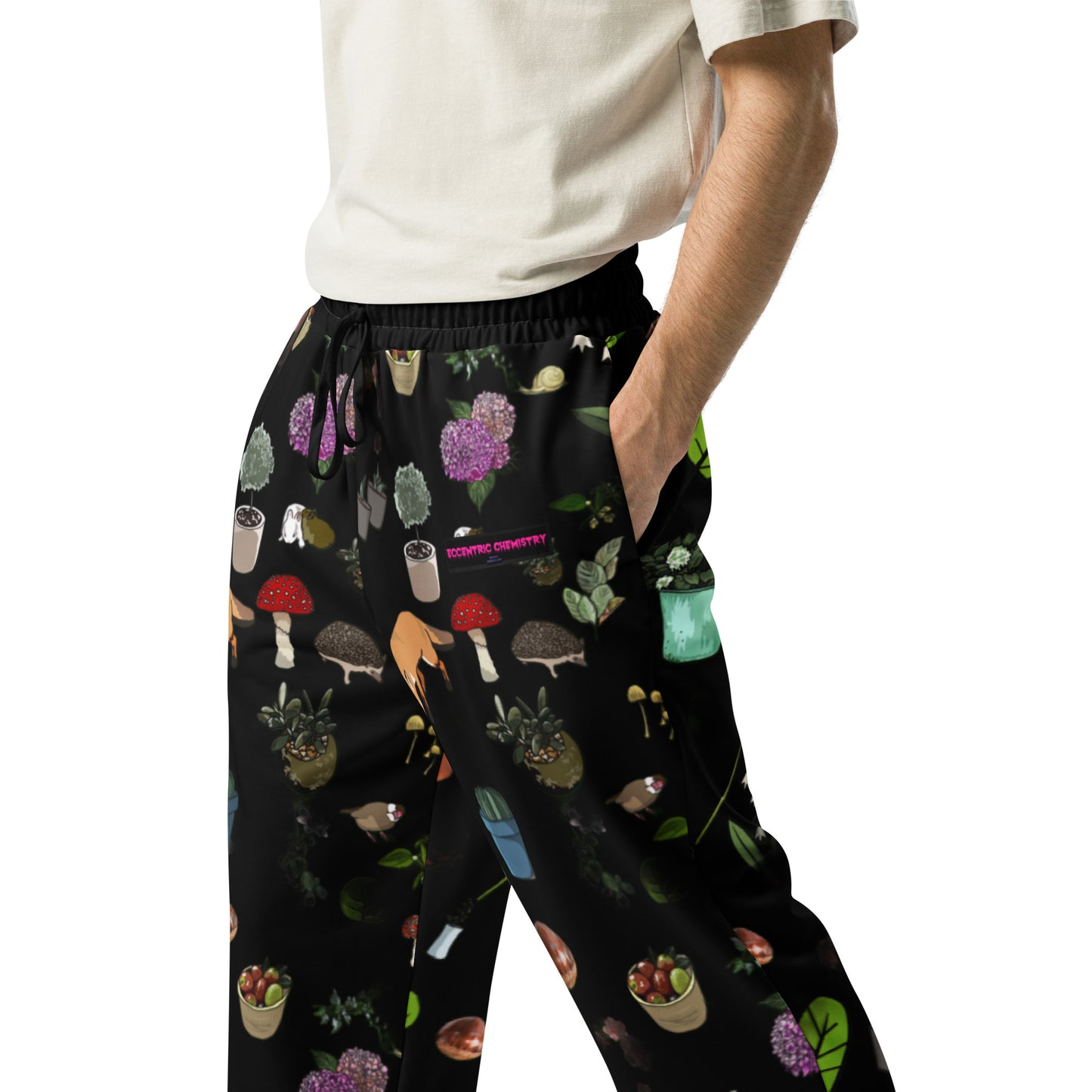 Unisex wide-leg Earth-Kind Habitat Joggers with all-over print in white, featuring eco-friendly design by Eccentric Chemistry.