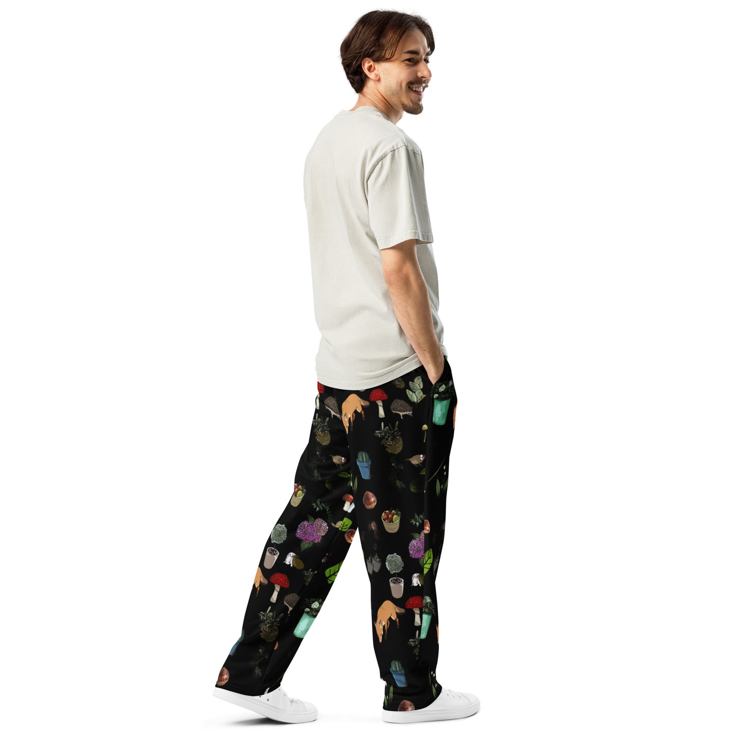 Unisex white Earth‑Kind Habitat wide-leg joggers with all-over print, showcasing relaxed fit and natural-inspired design.