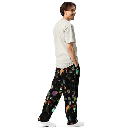 Unisex white Earth‑Kind Habitat wide-leg joggers with all-over print, showcasing relaxed fit and natural-inspired design.