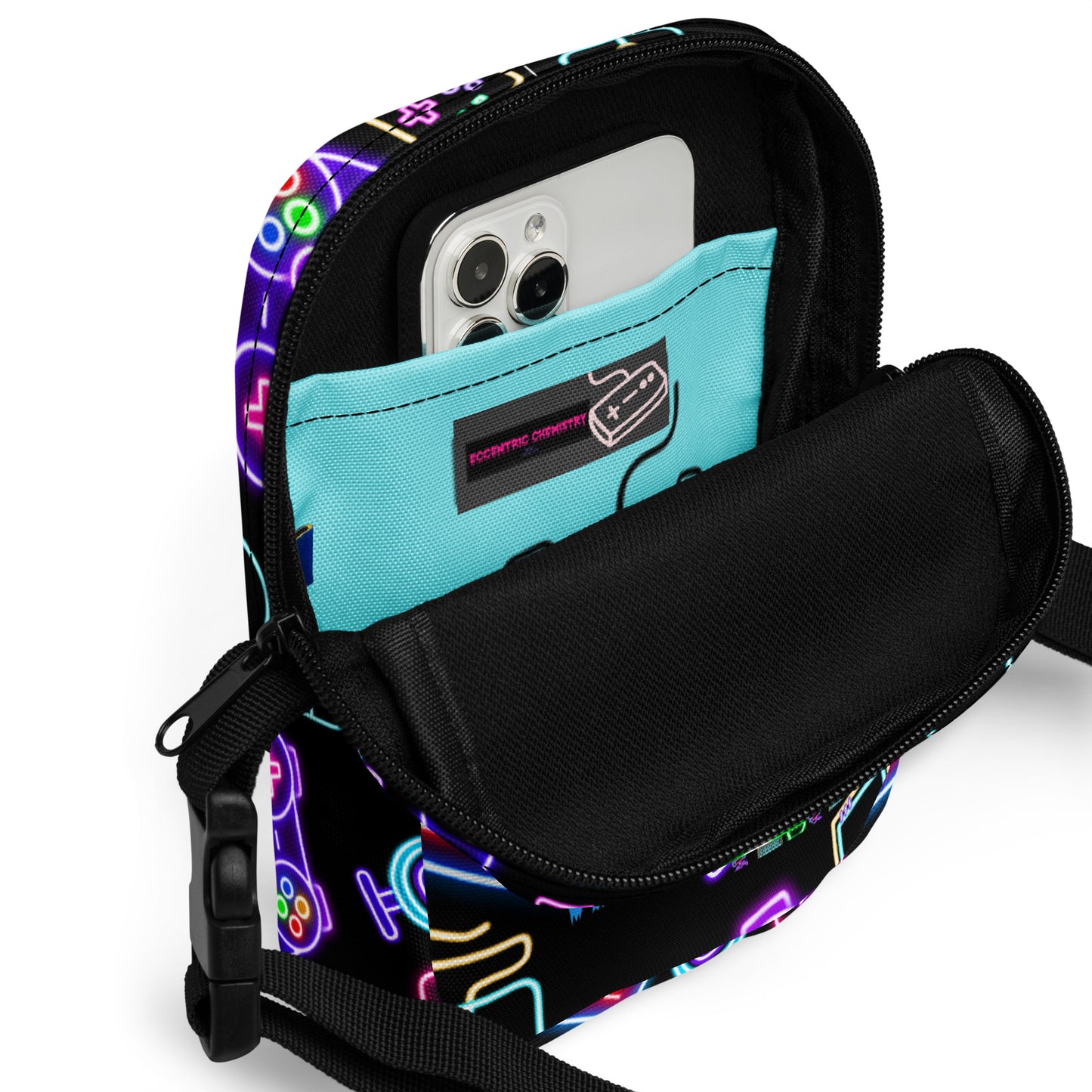 Eccentric Chemistry's Dork-Core Gaming Utility Crossbody Bag with all-over print in white, featuring multiple compartments and adjustable strap.