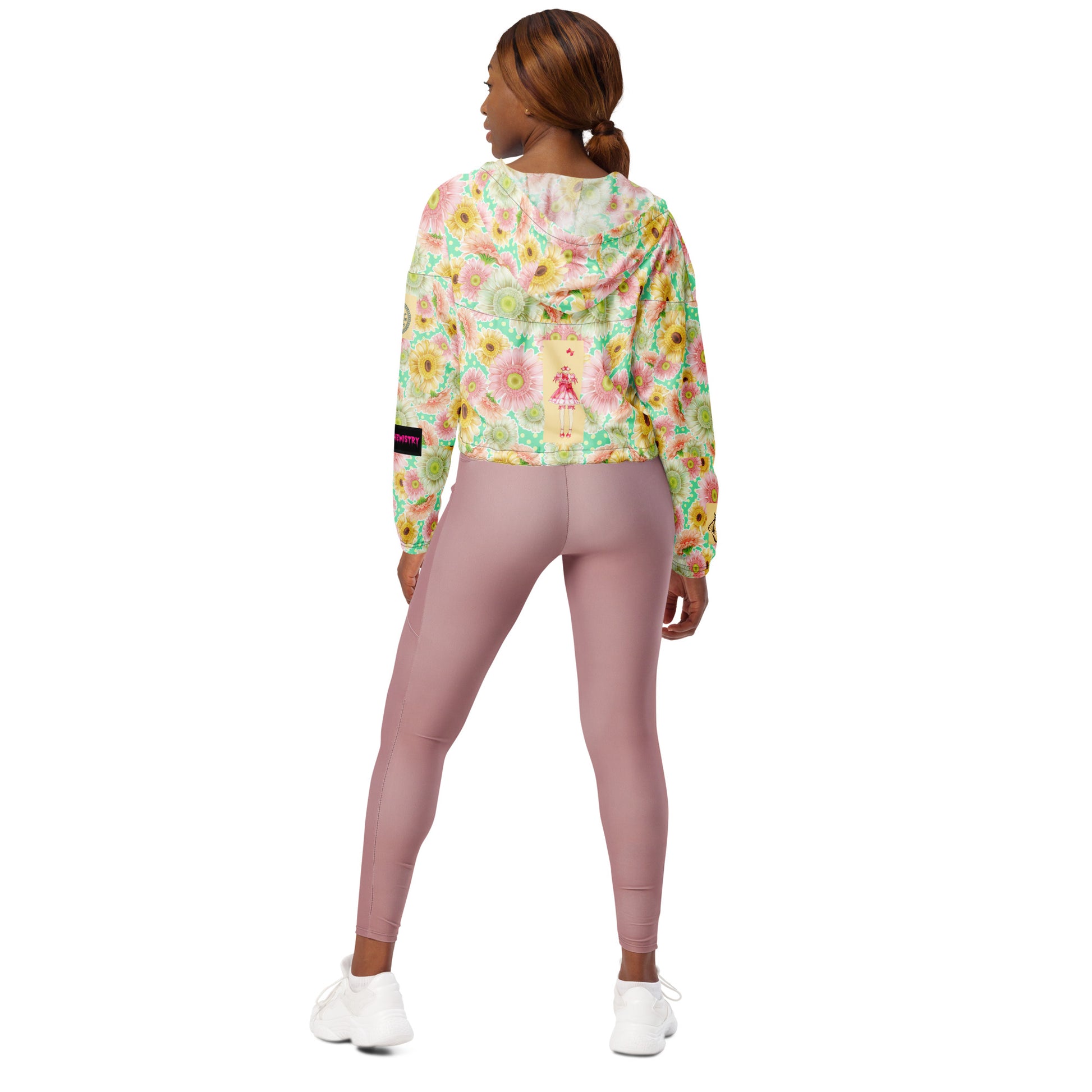 Black women's cropped windbreaker with all-over print, designed for wind resistance and maximum bloom pressure from Eccentric Chemistry.
