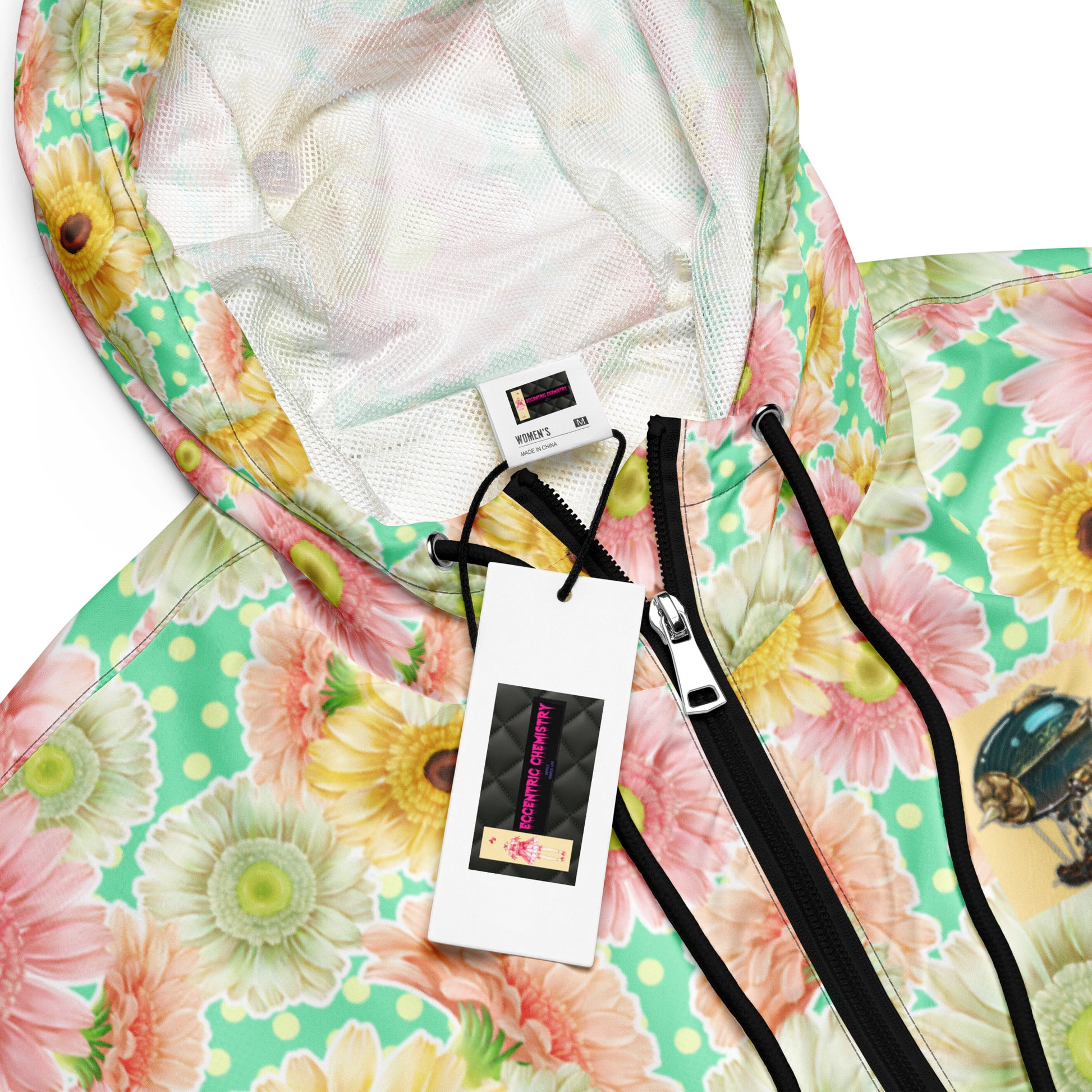 Black women's cropped windbreaker with all-over print, designed for wind resistance under maximum bloom pressure by Eccentric Chemistry.