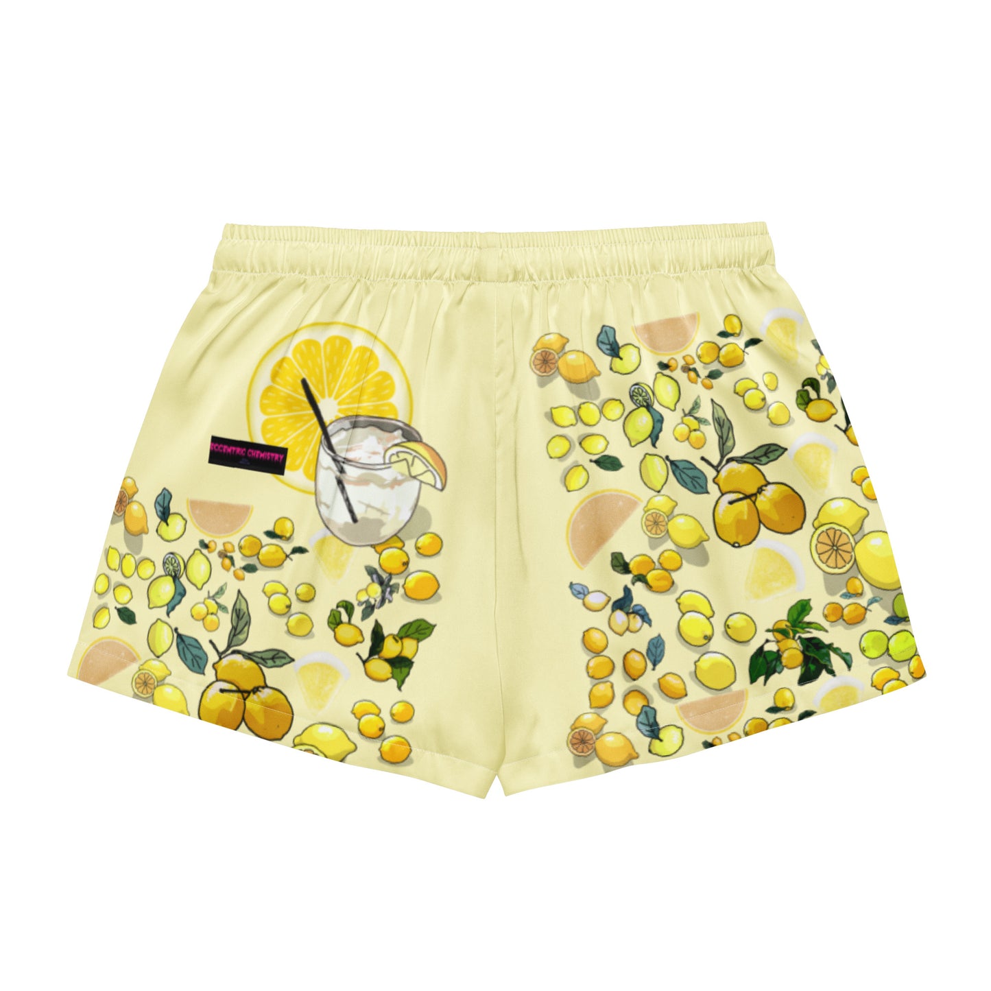 Women’s yellow lemon print pajama shorts by Eccentric Chemistry, featuring all-over light yellow lemon design on white fabric.