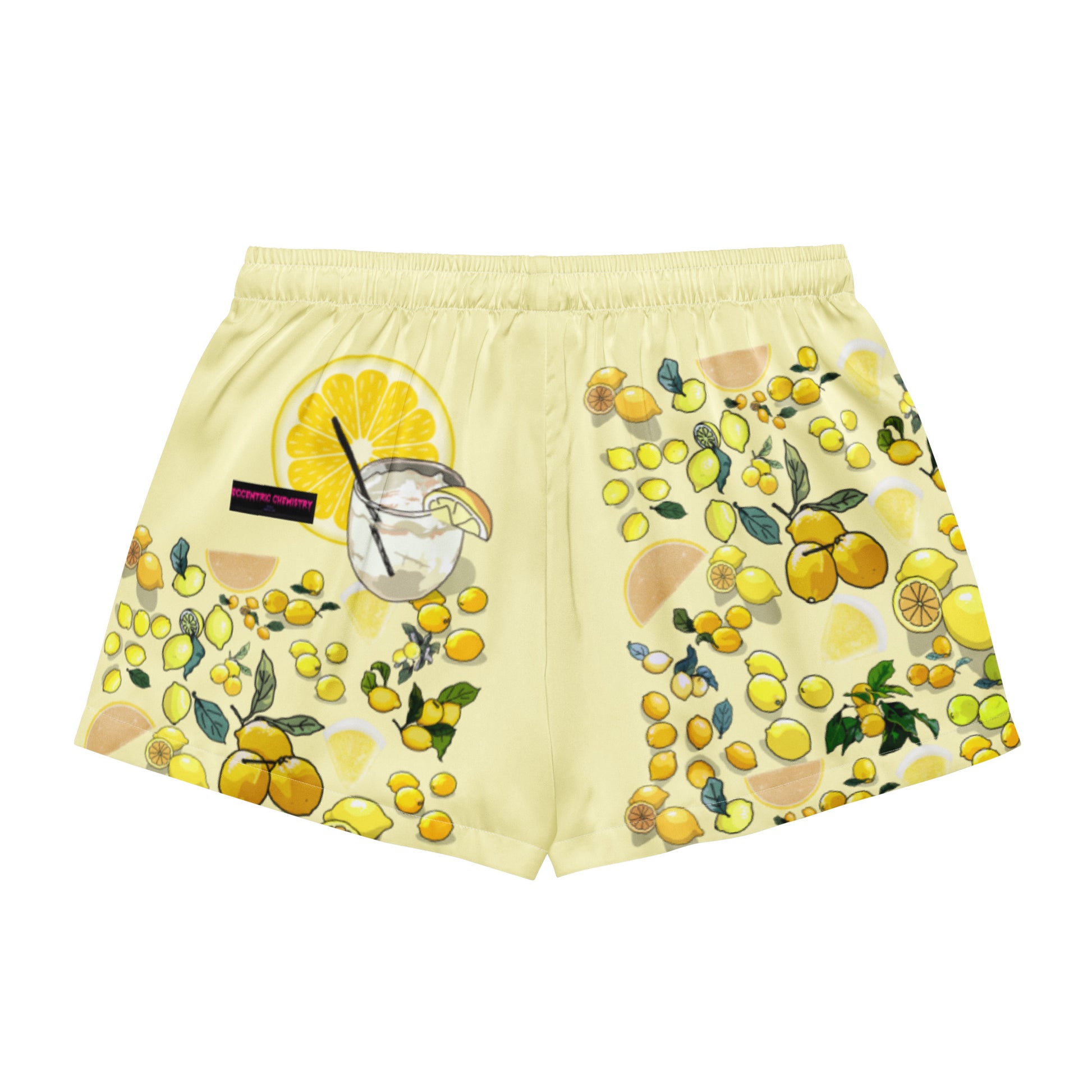 Women’s yellow lemon print pajama shorts by Eccentric Chemistry, featuring all-over light yellow lemon design on white fabric.