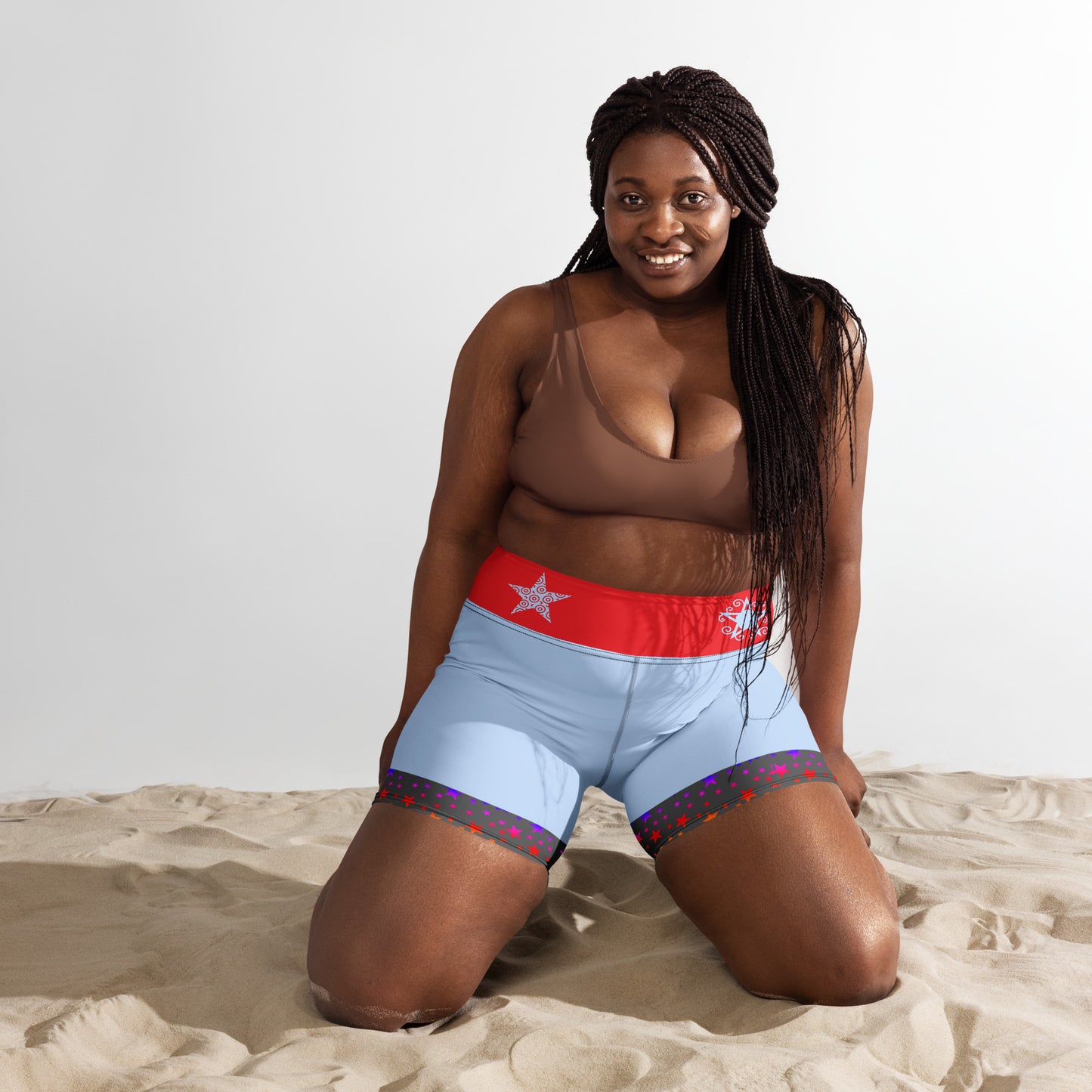 Women's yoga shorts with colorful galaxy and motion print by Eccentric Chemistry, featuring an all-over vibrant design.