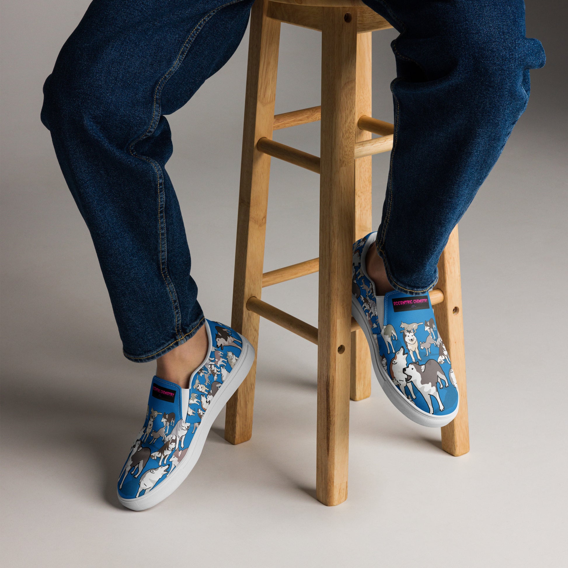 White men's slip-on canvas shoes by Eccentric Chemistry featuring a sleek design and comfortable fit.