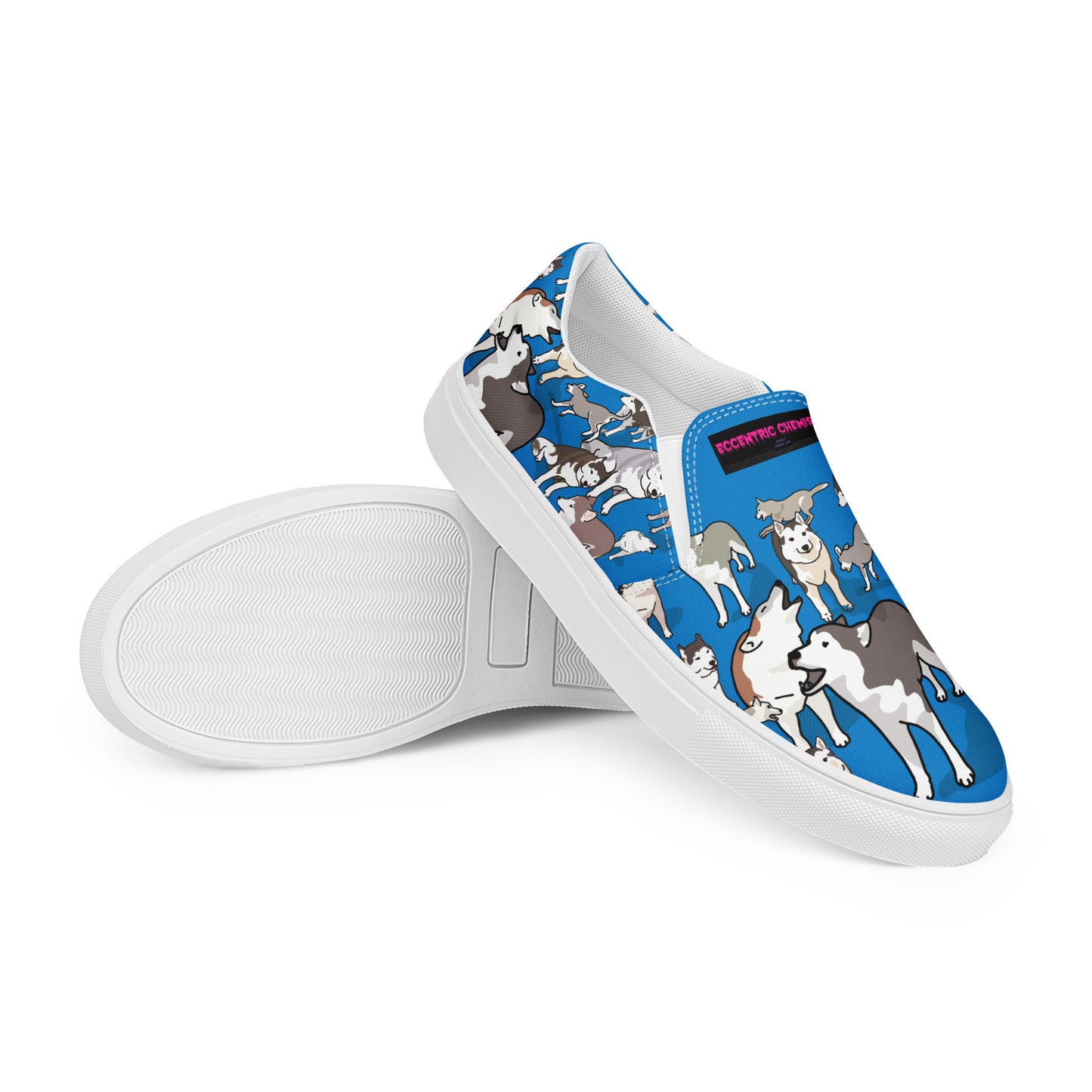 White men's slip-on canvas shoes by Eccentric Chemistry with a sleek, casual design, shown from the front right angle.