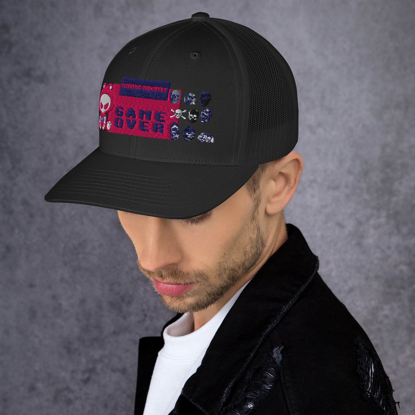 Black pixel panic experiment trucker cap by Eccentric Chemistry with a retro-style mesh and adjustable snapback design.