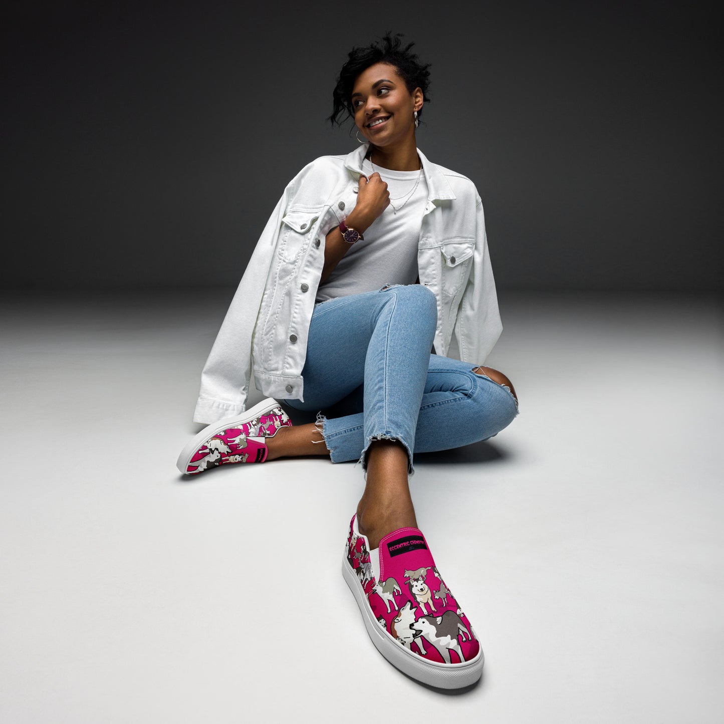 Women’s white slip-on canvas shoes with bow detail from Eccentric Chemistry’s Bow Wow Wow Quantum Wag Experiment collection.
